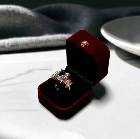 Artificial Ring with a large central diamond and smaller diamonds