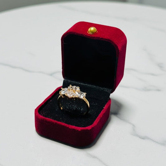 Artificial ring with four clear gemstones