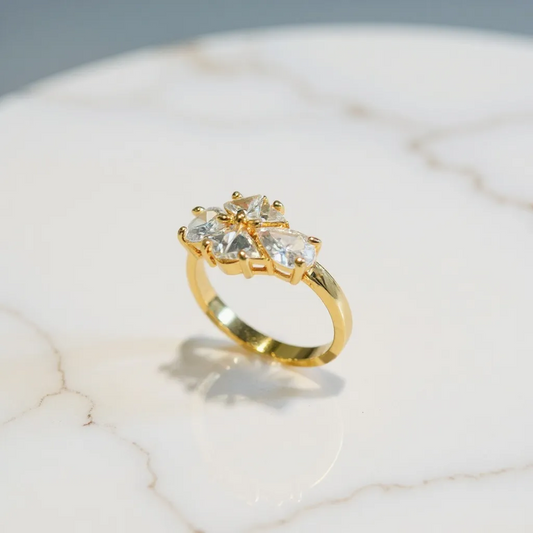 Artificial ring with four clear gemstones