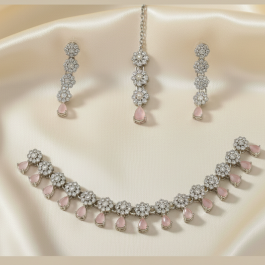 Necklace and earrings set with pink stones
